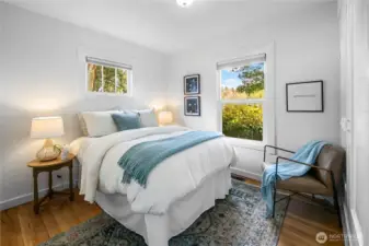 Before heading upstairs, you'll find this main floor bedroom. Once again noticed just how light and bright these rooms are.