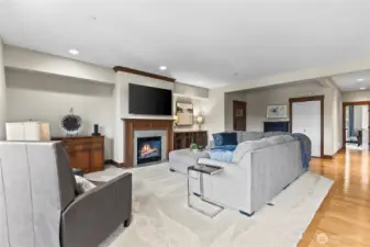 Oversized living room with plush carpet and gas fireplace