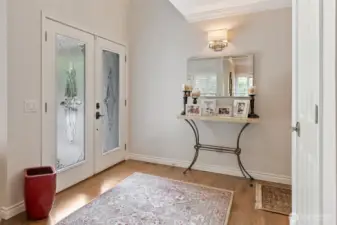 The home’s entryway welcomes you with gleaming hardwood floors that set the tone for elegance throughout.