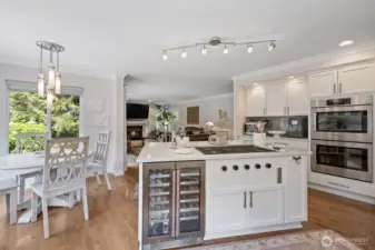 The kitchen island is elevated by a beautifully designed built-in wine refrigerator, seamlessly blending function with style.