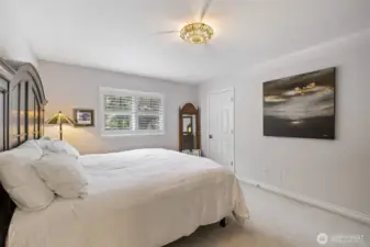 The 2nd bedroom is bright and airy, and filled with natural light.  Definitely a welcoming and versatile space. Perfect for a guest room, home office, or cozy retreat, this bedroom combines comfort and style while offering serene views of the surrounding property.  Walk-in closet provides ample room for clothing storage.