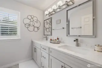 The upstairs shared bathroom is thoughtfully designed for both style and convenience. Featuring dual sinks, it provides ample space for family members or guests to get ready comfortably. Elegant finishes, a bright and airy layout, and well-planned storage make this bathroom both functional and inviting, perfectly complementing the home’s overall design.