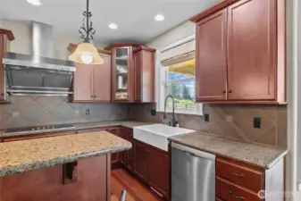 Granite counter tops, new farmhouse sink and new faucet really complete the stunning kitchen