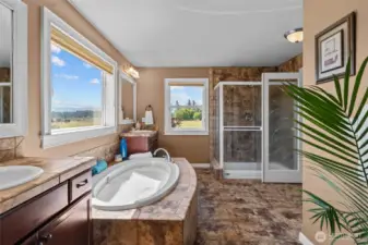 Complete with dual sinks, the primary bathroom offers ample space and a thoughtful layout for everyday convenience