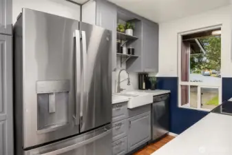 Updated kitchen with stainless appliances, updated fixtures, Farm sink, and plenty of storage