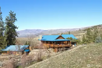 Tucked in the rolling hills, the home is perfectly situated for both privacy and views. To the left of the home, a well-built yet artistic outbuilding holds a green-house type space on one side and an artist/craft space on the other. Rustic inside, but solid in structure and full of character, it holds abundant possibility for other uses - office? bunkhouse? ADU?