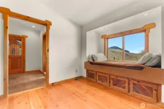 A second room on the other side of the primary bath is intended as a private sitting room or office and includes additional built in storage.