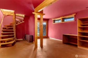 Daylight basement stays cool during the heat of summer. French doors access teh garden. Limited windows make this a great media room.