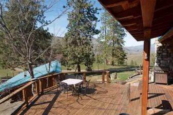 Huge porch off the kitchen overlooks the gardens.