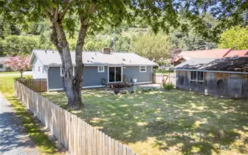 HUGE Fully fenced backyard with OVERSIZED garage/shop PLUS outbuilding