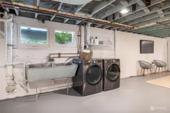 Lower level washer and dryer with sink already plumbed.