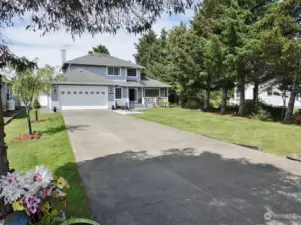 Large Concrete Driveway leading to the 2-car Garage.