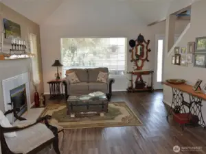Living Room w/ hip-styled vaulted ceiling.