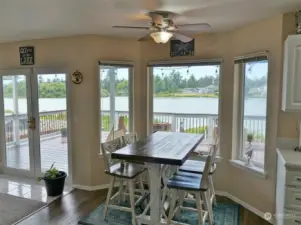 Kitchen Nook w/ Bay window. Doors lead to the Rear Deck.