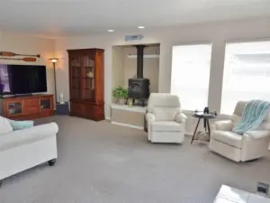 Family Room w/ a propane free-standing fireplace.  (It leads into the Laundry Room and Garage.)