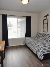 Downstairs Bedroom w/ vinyl-plank flooring.