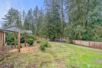 Here is another view of the fenced-in portion of the yard with chicken coop.