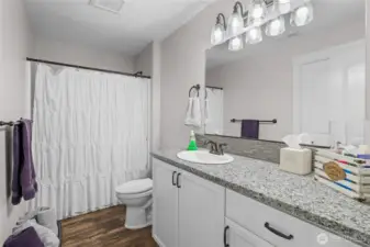 Upstairs full bath open to bedroom.