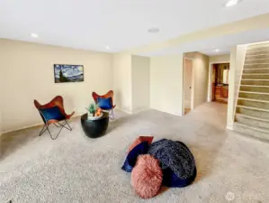 Spacious family room with slider that offers natural light and access to the rear patio and grounds.