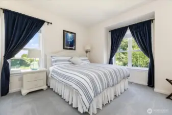 On the 2nd floor (Main Level) is another Guest Suite (bedroom #2) with plush carpeting, custom curtains & blinds and a large two door closet. Room accommodates a King-size bed