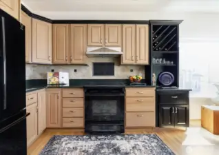 New black kitchen appliances (refrigerator, stove/oven & dishwasher) were installed in 2010. The stove/oven is fueled by propane gas, and has vented hood. Special wine storage area in the cabinets.