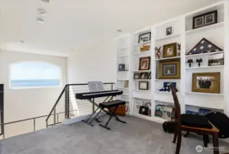 At the top of the stairs on the 3rd level is the entrance to Music area, and the Primary Ensuite.