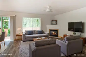 Gas fireplace in open living room.