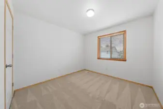 Bedroom #2. Window looks out to the backyard.