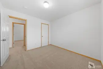 Bedroom #2. Another spacious bedroom room with closet door to the right.