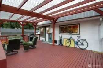 Spacious covered back deck with ramp access.