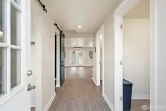 Looking from the back entry into the salon. Kitchen area on the right.
