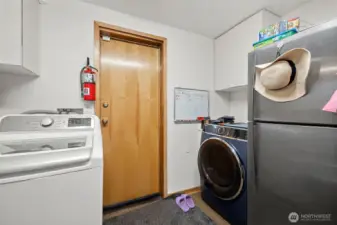 Mudroom with access to attached garage.