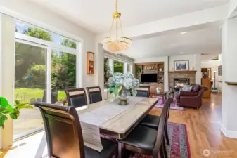 The dining area is adjacent to the large patio & yard.