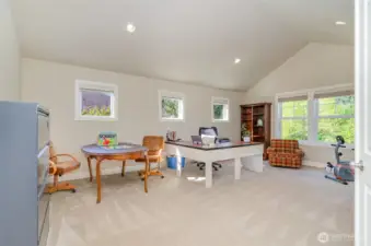 The upstairs bonus room features a vaulted ceiling, deck & plenty of space for the pool table or home theater.