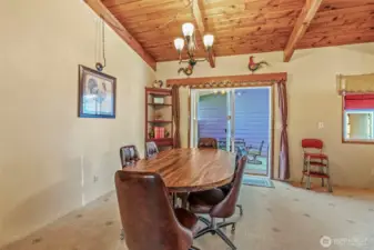 Dining room with slider to the huge covered outdoor area