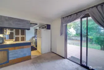 Another angle of kitchen and the outside deck off the kitchen sliding doors.