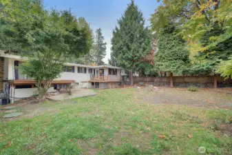 A lot of backyard space  ready for your vision