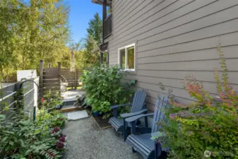 Additional seating and pathway to a sun-drenched patio!