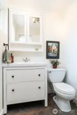 Updated 1/2 bathroom off primary suite with opening window