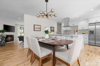 Gorgeous hardwood flooring runs throughout main living areas, creating cohesiveness
