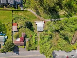 two outbuildings and a house on property