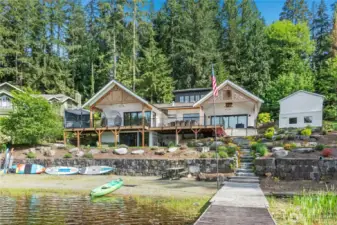 Unobstructed lake views, an expansive terraced back yard, a sandy beach and a private dock await you!