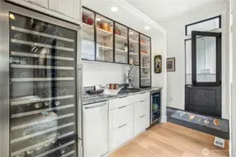 Built in beverage bar with ice maker, full size beverage cooler and a smaller mini fridge.