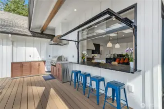 The pivot window opens to create a pass through for effortless outdoor dining.