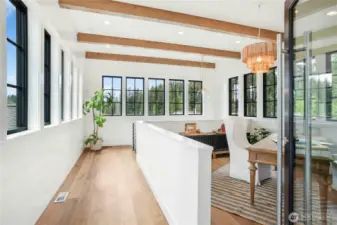 The entry tower features a home office area with walls of windows facing all directions.