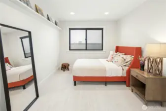 One of three additional main floor bedrooms.