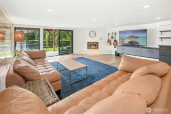 The expansive downstairs family room with sliding glass door to access backyard.