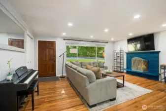 Recessed lighting & a huge picture window make for a light & bright space!