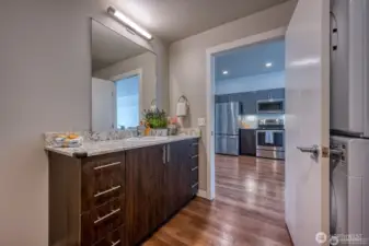 Functional design with adjacent kitchen, bath, and laundry