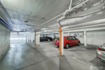 Secure garage on bottom level with 18 spots, 12 outdoor, uncovered parking spots.